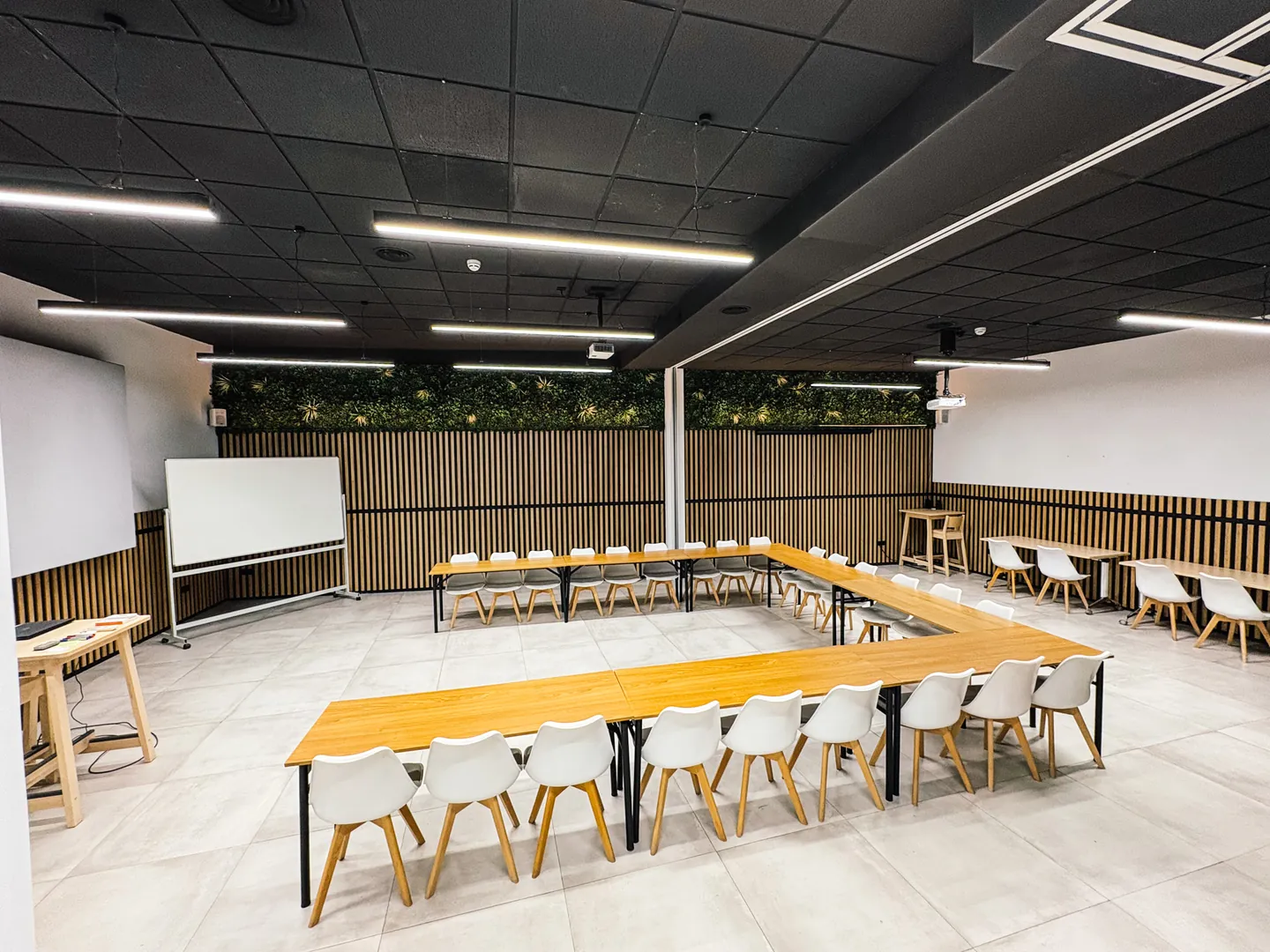 Glass conference room with projector and whiteboard