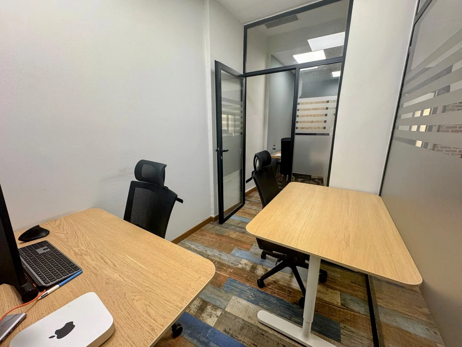 Private office with twin desks and ergonomic seating
