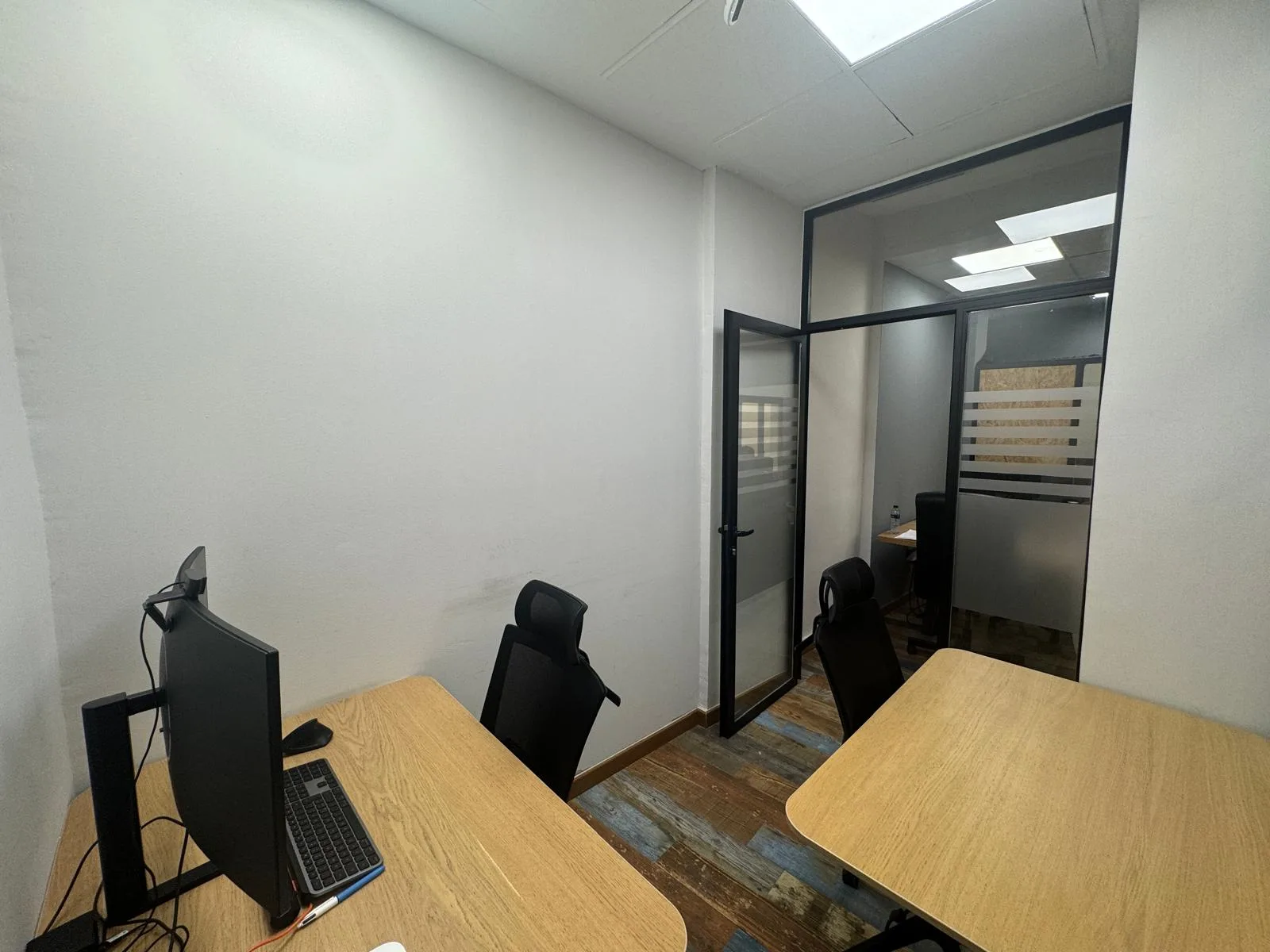 Spacious private office with glass partition